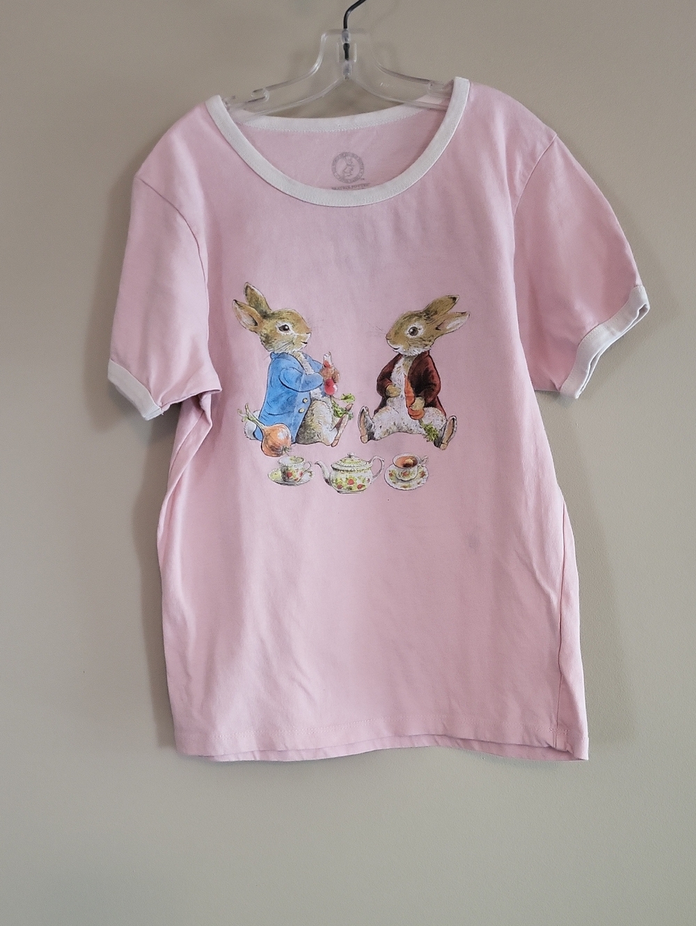 Beatrix Potter light pink tee shirt with white neck and sleeve trim